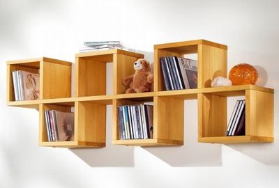Дизайн современных книжных шкафов для гостиной: фото интерьеров